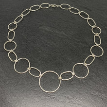Load image into Gallery viewer, Hammered silver open circle and oval necklace