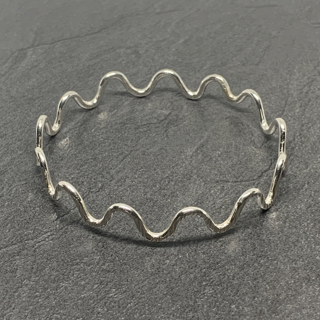 Hammered silver curly bangle