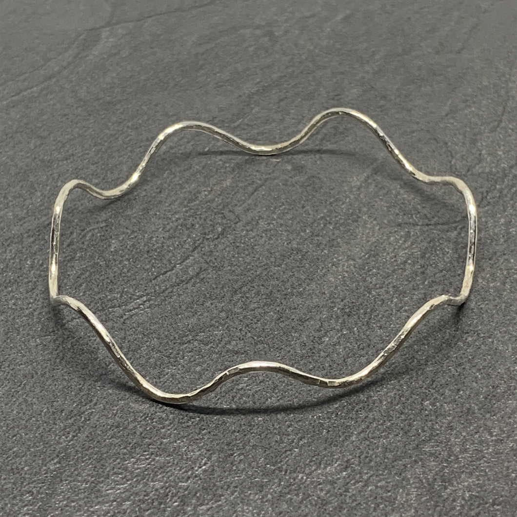 Hammered silver wavy bangle